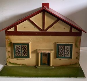 A toy house on a white surface AI-generated content may be incorrect.