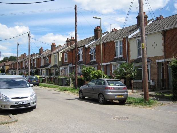 Cars parked on the side of a street Description automatically generated with medium confidence