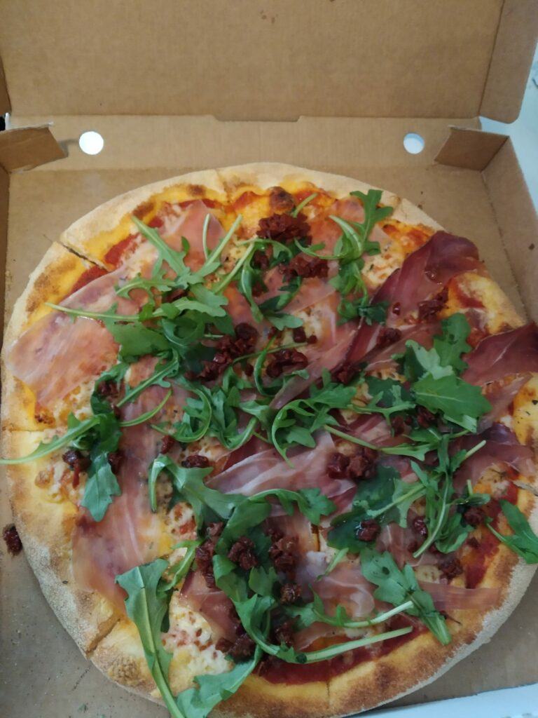 Pizza med ruccola och bacon