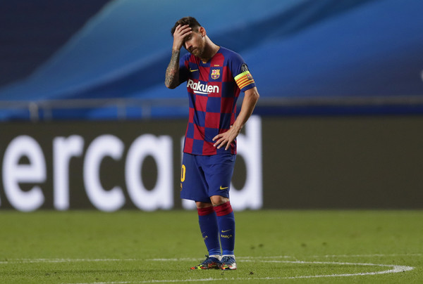 Lionel Messi, looking dejected against Bayern Munich / Manu Fernandez/ Getty Images Europe