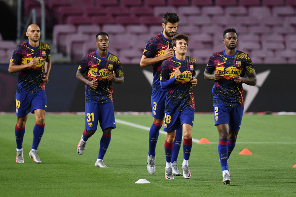 FC Barcelona players warming up before a Laliga fixture / Getty Images Europe