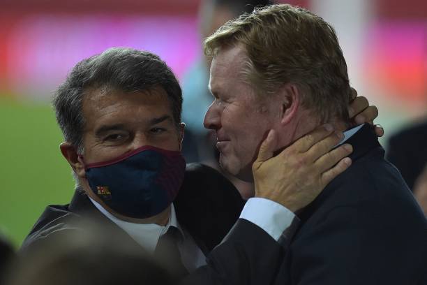Ronald Koeman celebrates with Joan Laporta after winning the Copa del Rey final (Photo by CRISTINA QUICLER / AFP)
