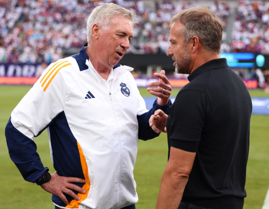 Hansi Flick (R) with Real Madrid coach Carlo Ancelotti at the preseason Clásico / GETTY IMAGES