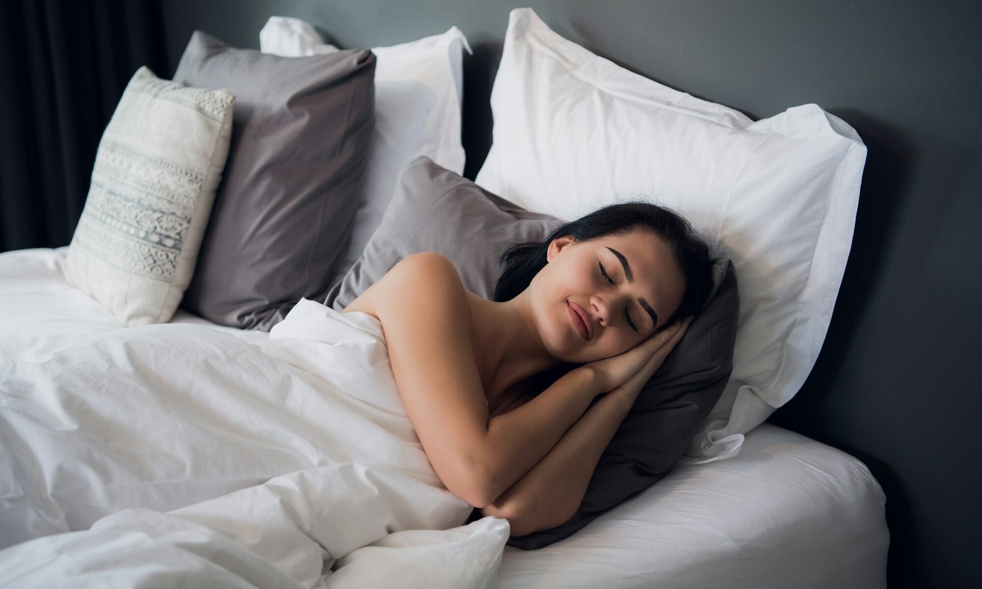 Good dreams make your day better. Attractive young woman sleeping joyfully