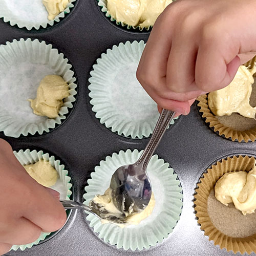 Cake mixture is put in to cupcakes