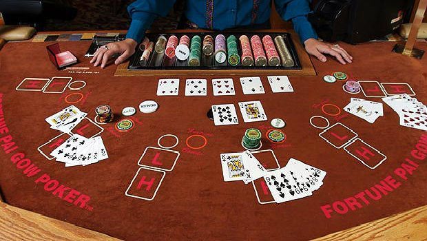 How does Pai Gow Poker influence the design of casino tables?