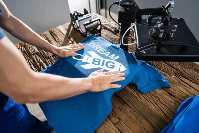Man printing a T-shirt from home
