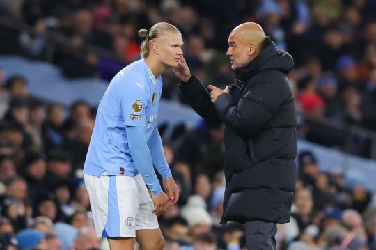 Erling Haaland of Manchester City receives instructions from Josep 'Pep' Guardiola, manager of Manchester City, before coming on as a substitute during the Premier League match between Manchester City and Burnley FC at Etihad Stadium on January 31, 2024.