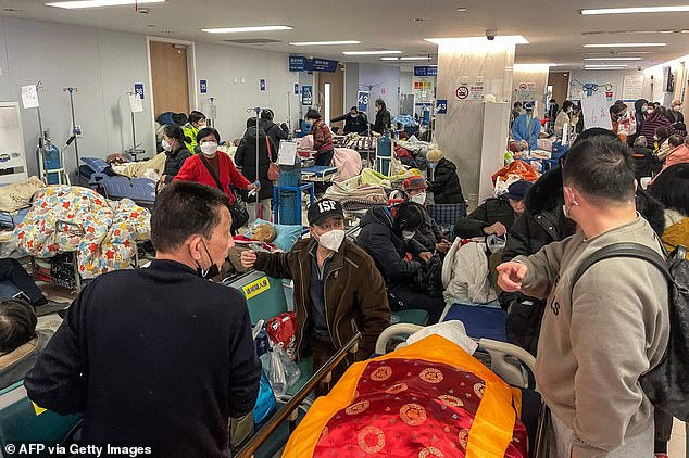 Pictured: Covid patients on stretchers are seen at Tongren hospital in Shanghai, China, today