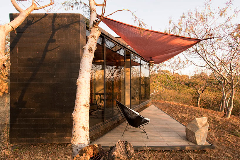 omar lopez bautista materialize an experience in a small black concrete cabin 7