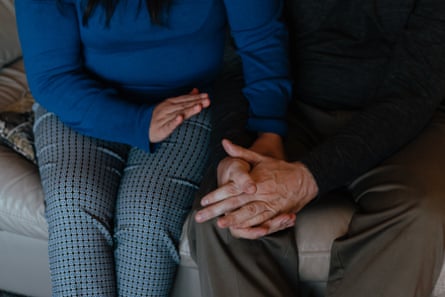 Yedid Sanchez and Tom Kobylecky sit on a couch together in the home they share with Tom’s father, in New Lenox, Illinois.