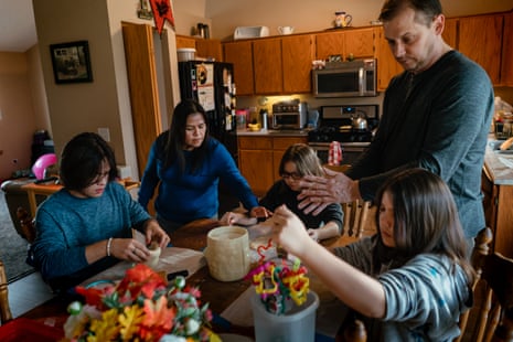 Yedid Sánchez and Tom Kobylecky make holiday cookies with their three children in the home they share with Tom’s father, in New Lenox, Illinois.