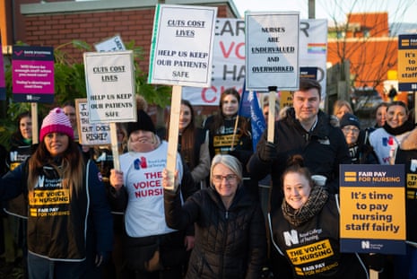 Striking nurses on a picket line outside the Walton Centre in Liverpool this morning.