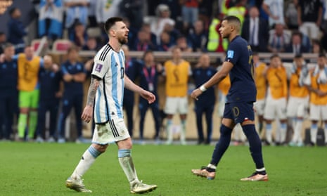 A photo of Lionel Messi of Argentina and Kylian Mbappe of France during the penalty shootout of the FIFA World Cup Qatar 2022 Final.