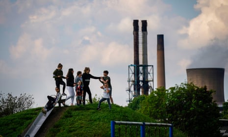 A photo of children playing in park against the backdrop of British Steel's Scunthorpe works in 2019.