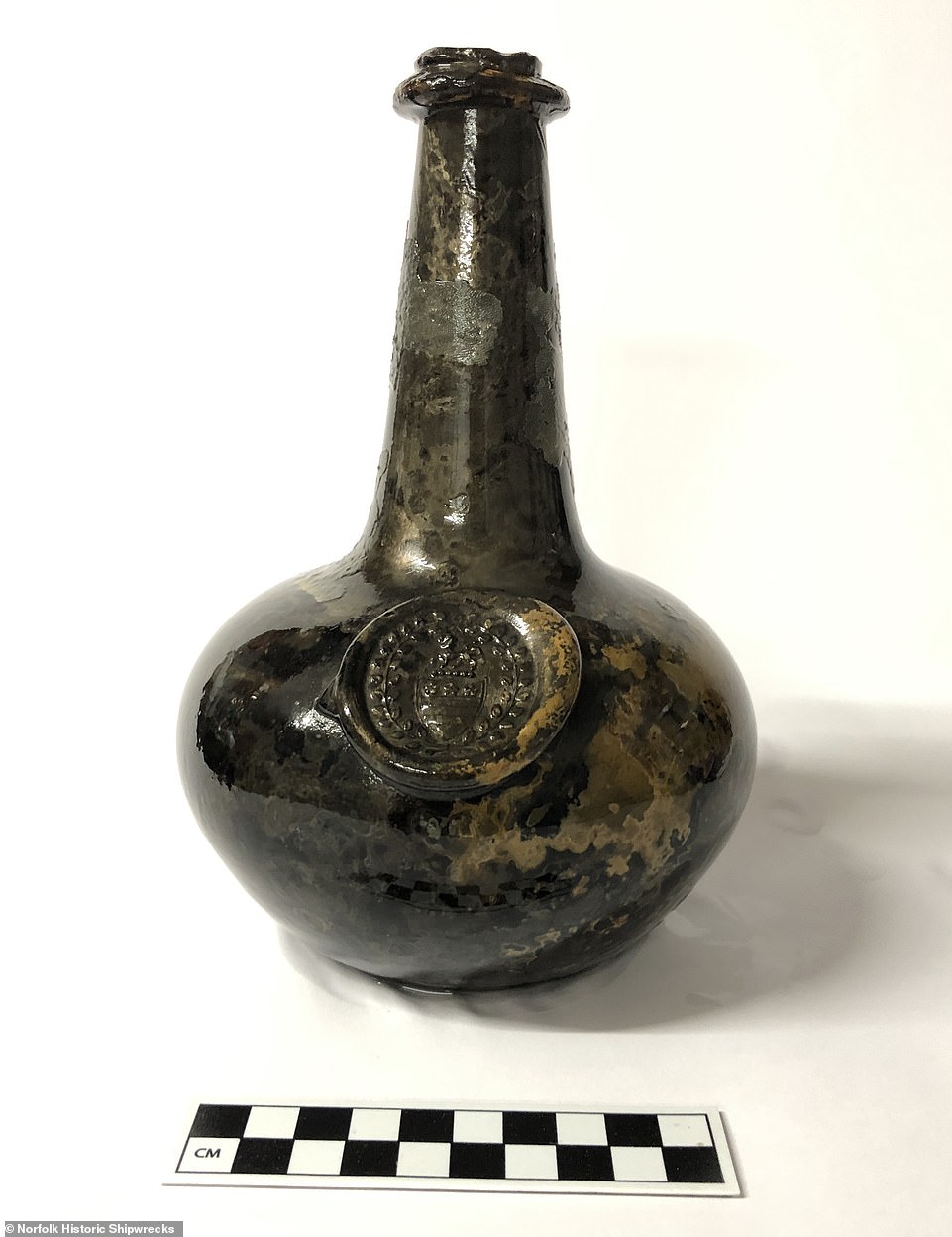 Pictured, one of the glass bottles found with the wreck, which also bears a seal with the crest of the Legge family, ancestors of George Washington, the first US President