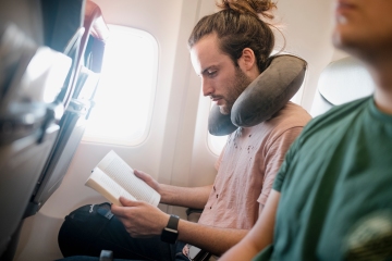 You've been wearing your travel pillow WRONG - the right way is a game-changer