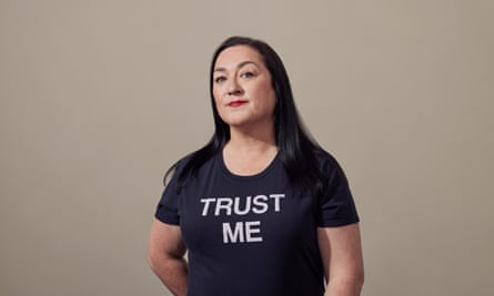Portrait of Jenny Radcliffe wearing a T shirt with “Trust Me” written on it.