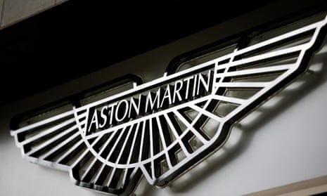 An Aston Martin logo is seen on the outside of a dealership in central London.