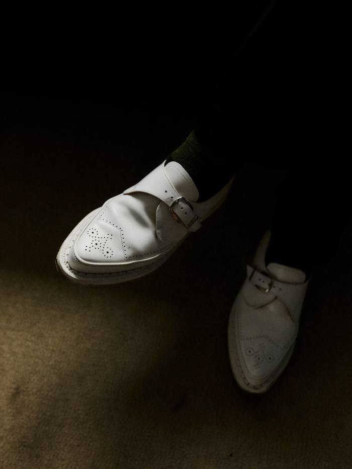 Cruickshank’s white buckled loafers