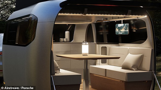 At the front are two seats on each side that can be folded into a single bed or kept upright for campers to access a table in the middle - the table also folds away when not needed.
