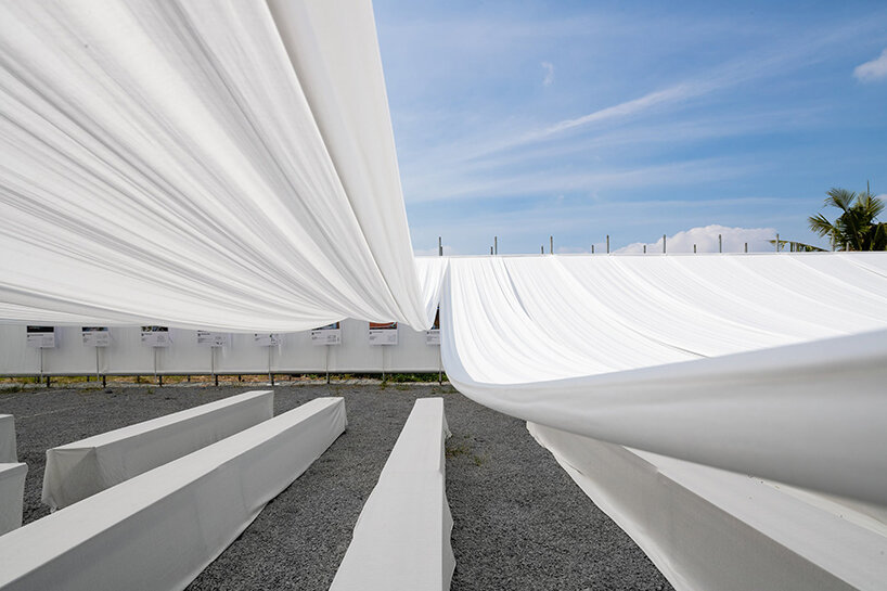 MIA design studio drapes rows of swaying white fabric over new ashui pavilion in vietnam