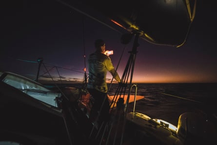 Simon Fisher tries to capture last rays of sunset with his phone.