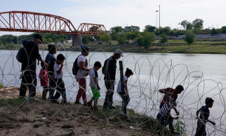 Migrants after having crossed the Rio Grande in Eagle Pass Texas in May 2022.