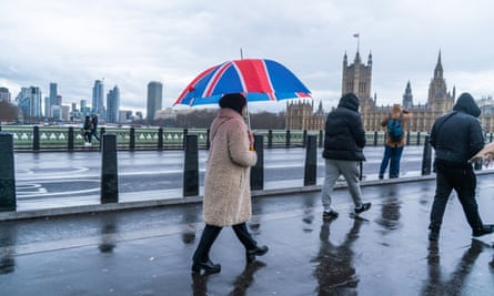 Pedestrians endure chilly conditions on Westminster Bridge, London.