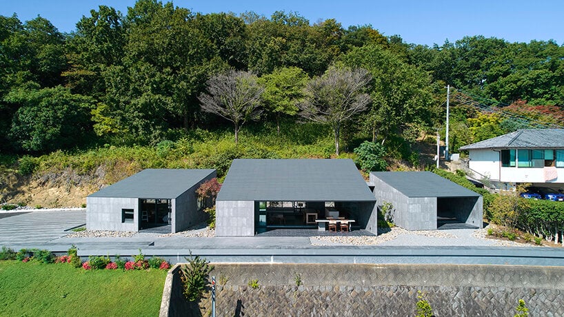 suppose design office turns sculptural blocks into meditative two-family dwelling in japan