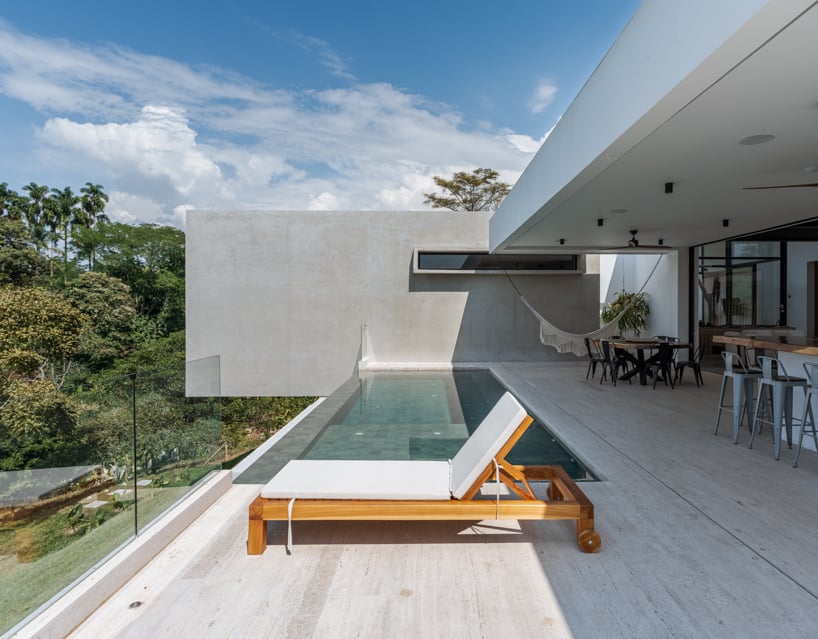 concrete residence expands cantilevered volumes in rural colombia
