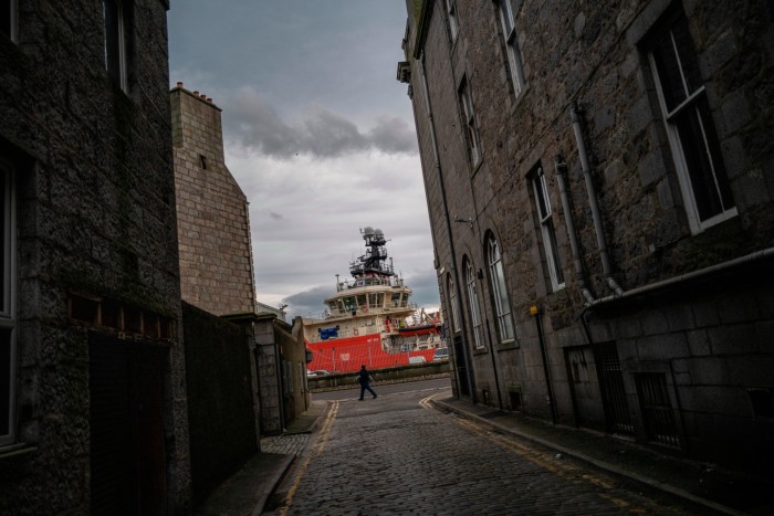 A view from a street of a ship in Aberdeen harbour