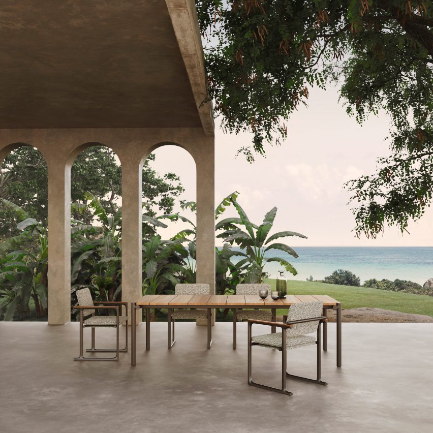 Photograph showing dining table and chairs on terrace with sea view