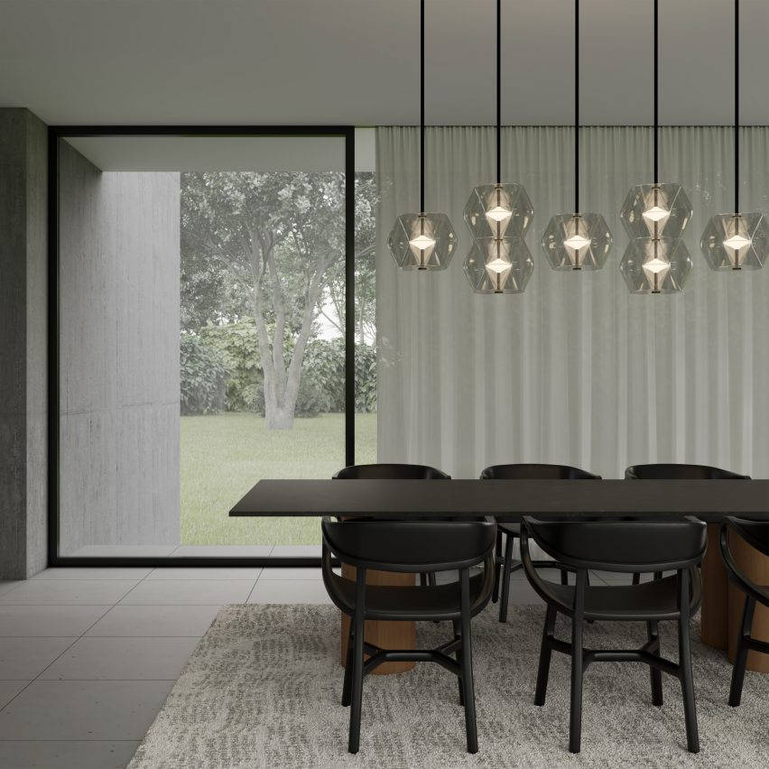 Argyle pendant lights by Rakumba over a dark wood table in a dining room