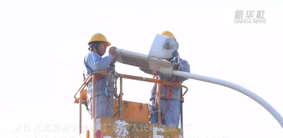 Engineers work on street lights in Jiangsu Province, China.