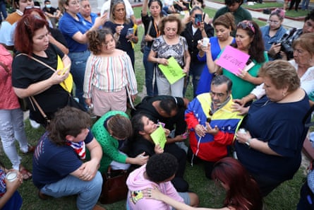 Mourners pray during a memorial vigil a day after eight were killed by a vehicle at a bus stop near Ozanam Center, a shelter for migrants and homeless, in Brownsville, Texas.