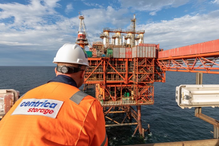 A Centrica worker in hi-vis clothing looks out over part of the Rough storage facility at sea