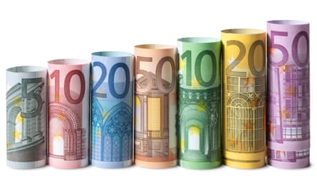 Rolled-up euro banknotes.