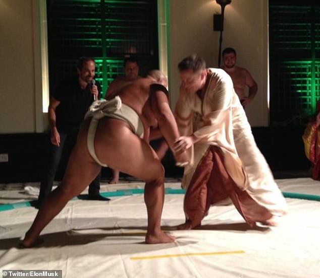 Elon Musk, pictured here fighting a sumo wrestler, has trained in Kyokushin karate, taekwondo, judo, and 'Brazilian jiu-jitsu briefly' throughout his life