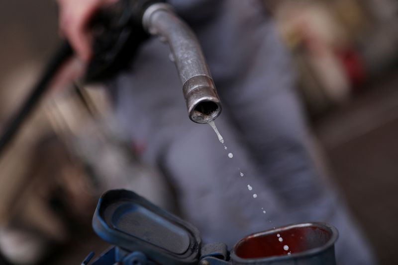 US crude oil gains on supply cuts, focus shifts to holiday demand