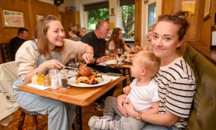 Vicki Leach (left) and Lucy Weston with their baby Milo