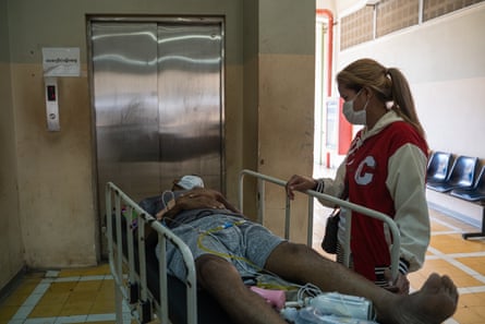 Phal Pen is wheeled to take an exam at the Khmer-Soviet Friendship hospital in Phnom Penh, Cambodia.