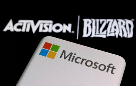 Microsoft logo is seen on a smartphone placed on displayed Activision Blizzard logo in this illustration taken.