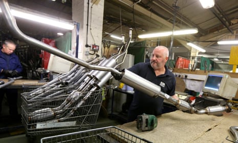 An employee moves a catalytic converter emission control device in Mansfield.