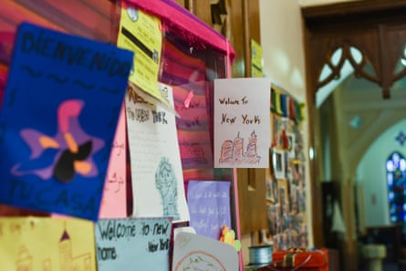 Handmade cards with welcoming messages to migrants hang at the Good Shepherd church in Brooklyn in late July.