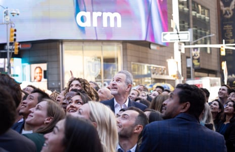 Rene Haas (centre), the CEO of ARM Holdings, with his corporate leadership team at the Nasdaq stock market today