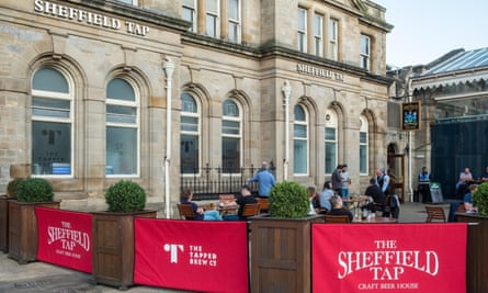 People drinking outside the Sheffield Tap, Sheffield, Yorkshire, England, UK.