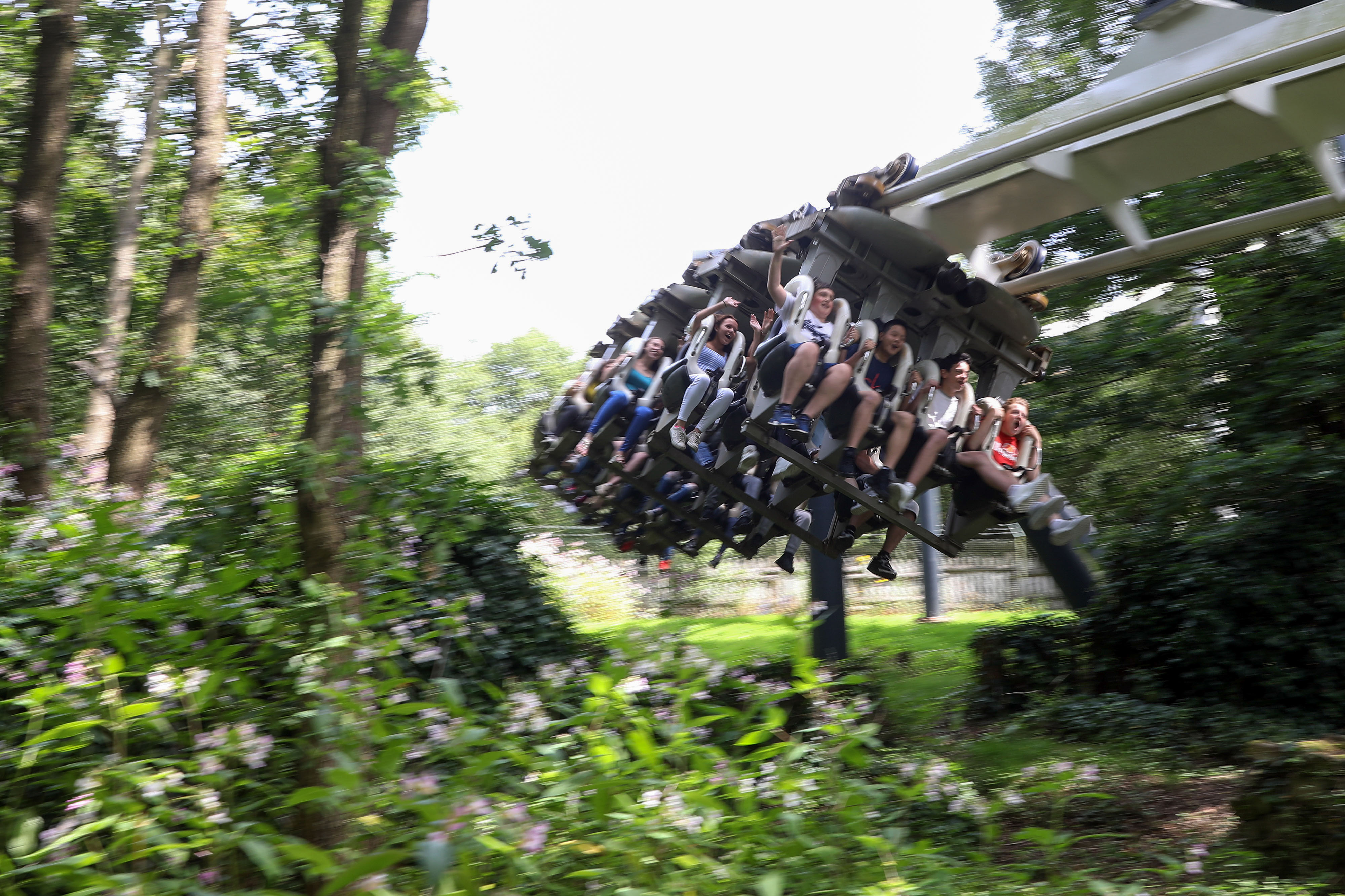 Visitors riding roller coaster at Alton Towers resort