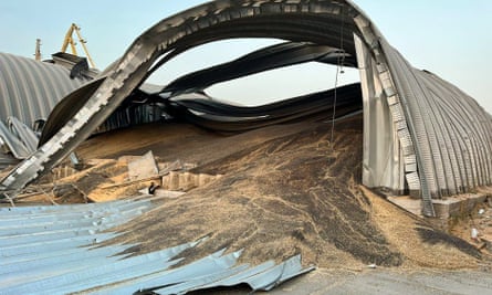 Grain seen spilling out of a damaged terminal with twisted metal