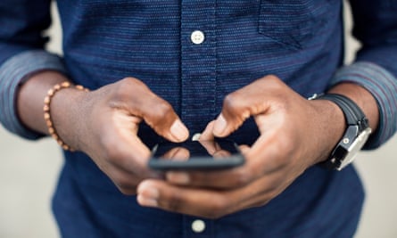 Midsection of a man using a mobile phone